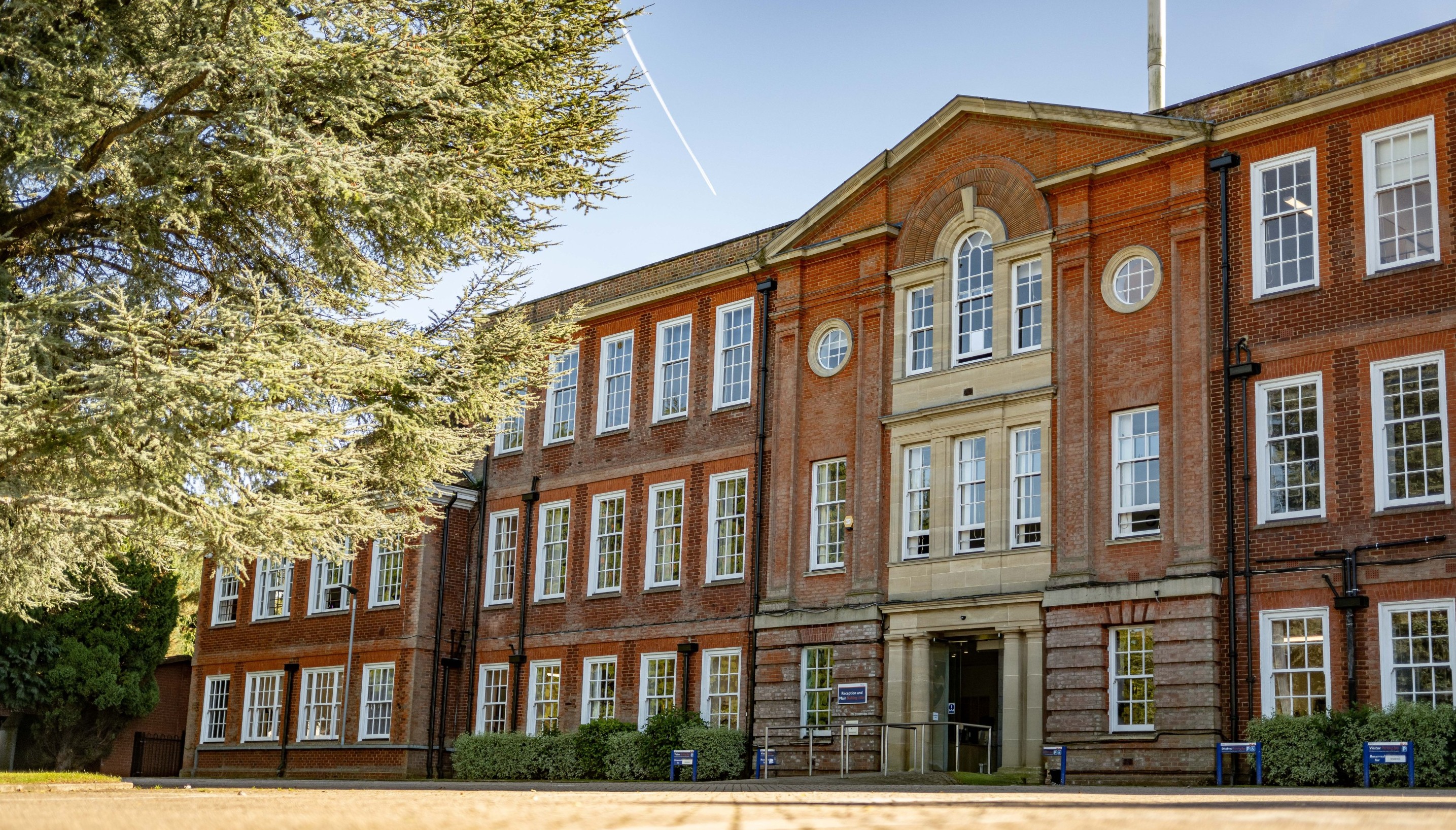 Main College entrance with Crest on doors