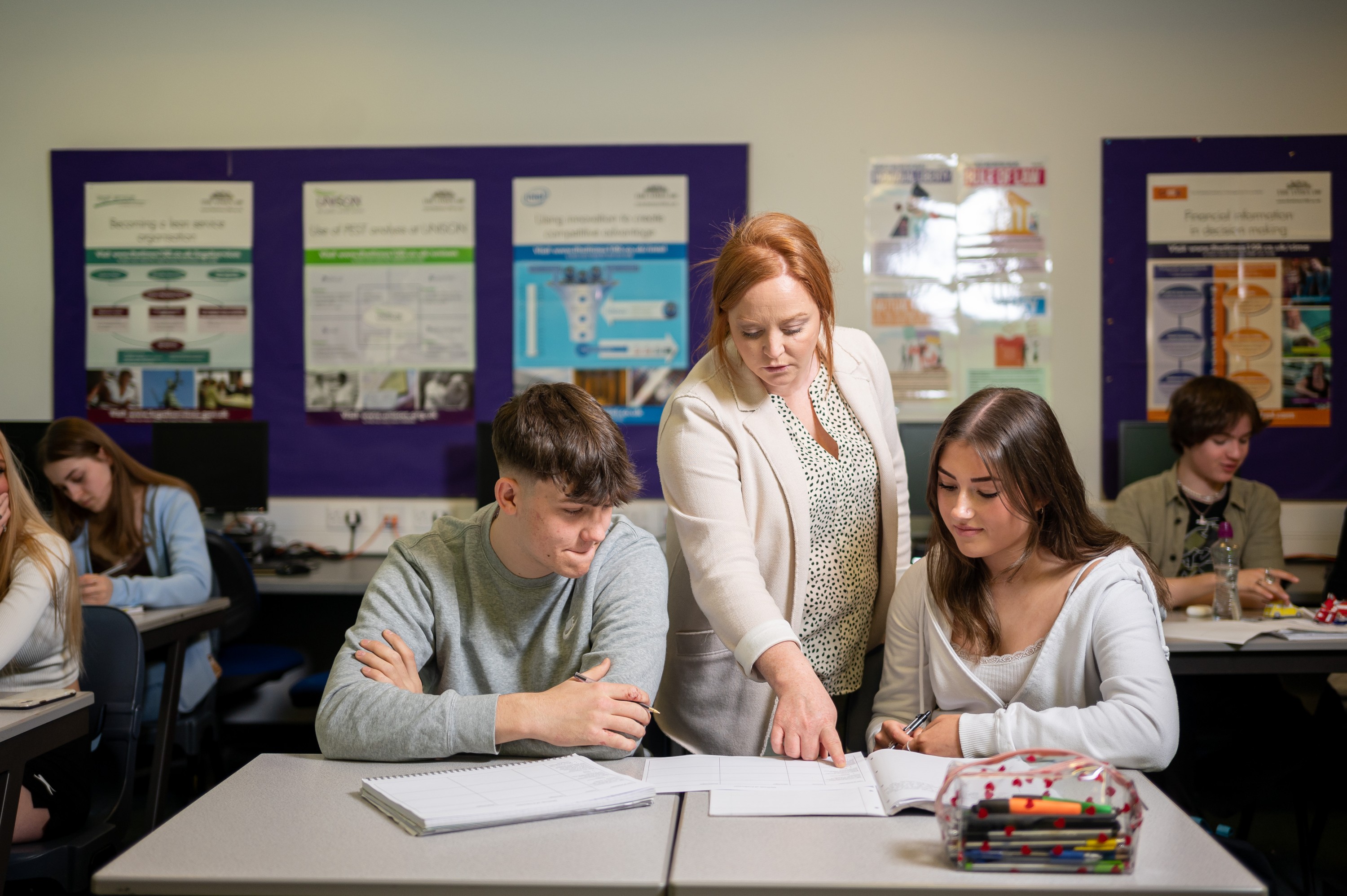 Business teacher supporting students